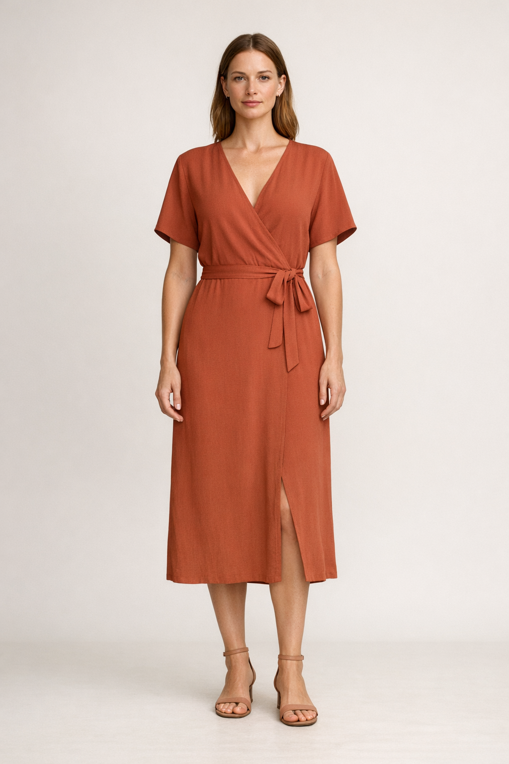 Solenne Wrap Dress on model in terracotta clay